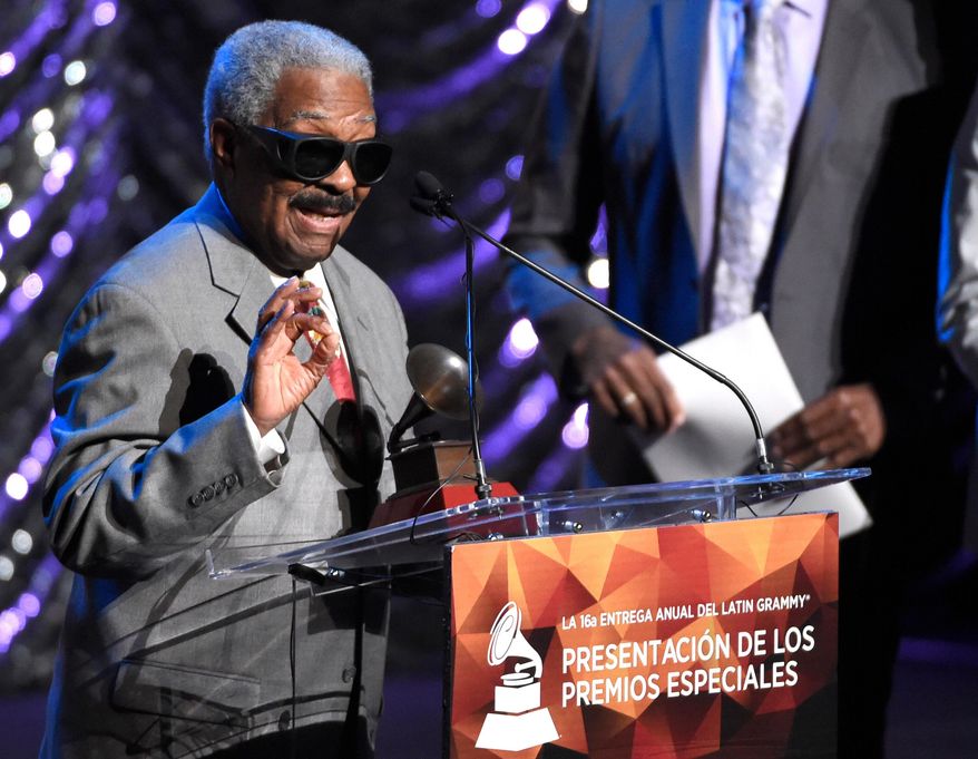 FILE - Rafael Ithier of El Gran Combo de Puerto Rico accepts the Lifetime Achievement Award at the Lifetime Achievement and Trustees Awards presentation at the Ka Theater in the MGM Grand Hotel on Wednesday, Nov. 18, 2015, in Las Vegas. (Photo by Chris Pizzello/Invision/AP, File)