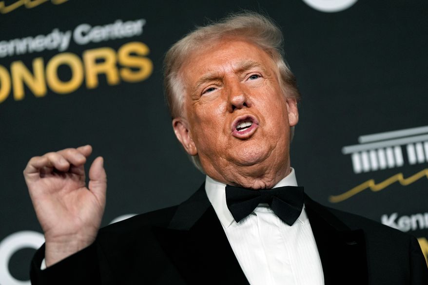 President Donald Trump talks to the media while walking the red carpet before the 48th Kennedy Center Honors, Sunday, Dec. 7, 2025, at the John F. Kennedy Center for the Performing Arts in Washington. (AP Photo/Julia Demaree Nikhinson)