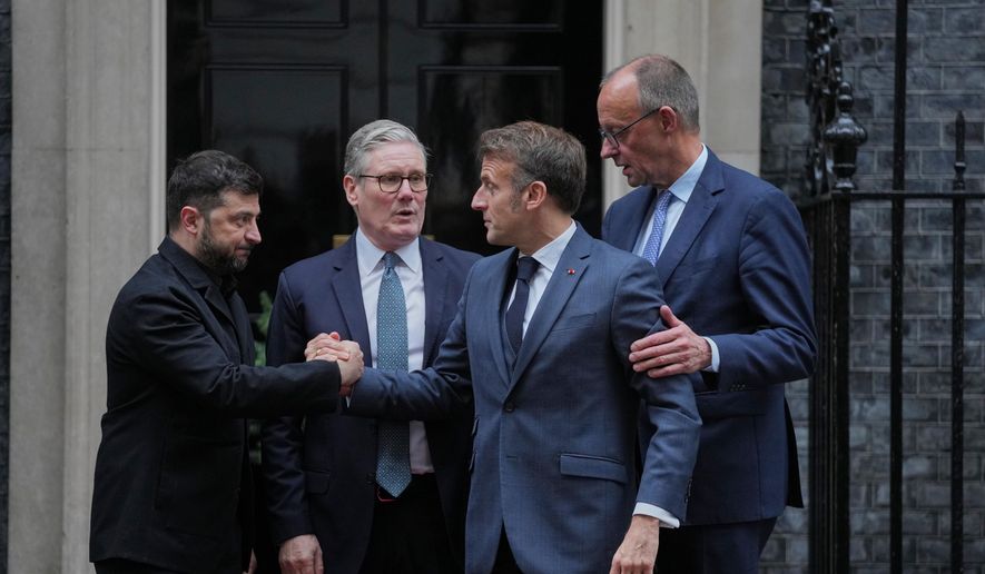 Ukrainian President Volodymyr Zelenskyy, left, with Britain's Prime Minister Keir Starmer, French President Emmanuel Macron, and German Chancellor Friedrich Merz pose on the doorstep of 10 Downing Street, London, Monday, Dec. 8, 2025, following a meeting of the leaders inside. (AP Photo/Kin Cheung)