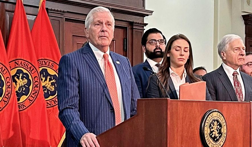 Nassau County Executive Bruce Blakeman, at podium, speaks during a news conference in Mineola, N.Y., March 6, 2024. (AP Photo/Philip Marcelo, File)