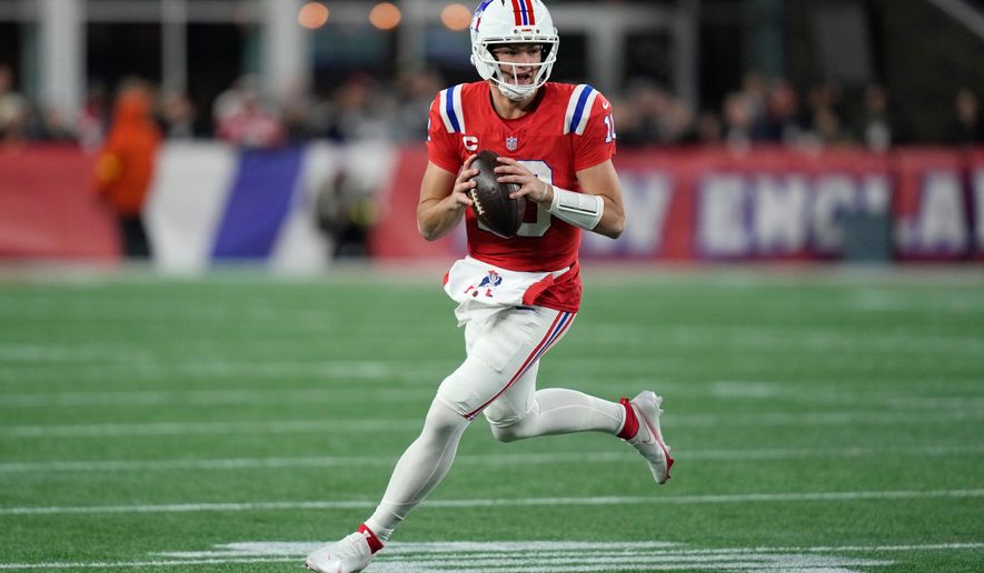 New England Patriots quarterback Drake Maye rolls out during the first half of an NFL football game against the New York Giants, Monday, Dec. 1, 2025, in Foxborough, Mass. (AP Photo/Charles Krupa)