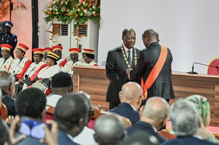 Ivory Coast President Alassane Ouattara is inaugurated at the Presidential Palace in Abidjan, Ivory Coast, Monday, Dec. 8, 2025. (Sia Kambou/Pool Photo via AP)