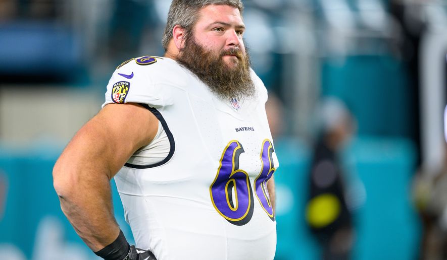 FILE - Baltimore Ravens guard Ben Cleveland (66) stands on the field before an NFL football game against the Miami Dolphins, Thursday, Oct. 30, 2025, in Miami Gardens, Fla. (AP Photo/Doug Murray,File)