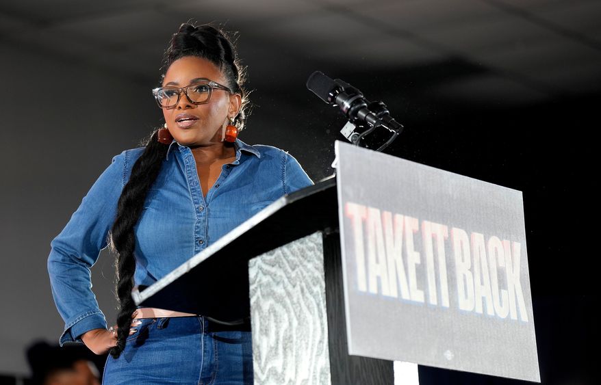 U.S. Rep. Jasmine Crockett, D-Texas, speaks to the crowd before California Gov. Gavin Newsom took the stage during a rally with Harris County Democrats at the IBEW local 716 union hall on Saturday, Nov. 8, 2025, in Houston. (AP Photo/Karen Warren)