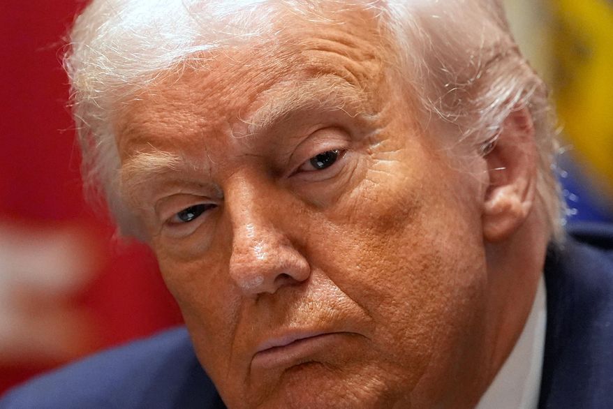 President Donald Trump listens during a roundtable on farm subsidies in the Cabinet Room of the White House, Monday, Dec. 8, 2025, in Washington. (AP Photo/Alex Brandon)