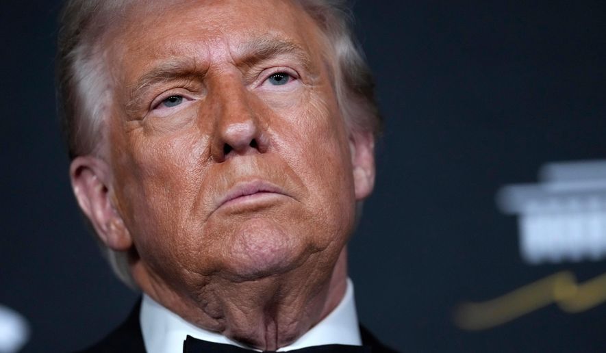 President Donald Trump walks the red carpet before the 48th Kennedy Center Honors, Sunday, Dec. 7, 2025, at the John F. Kennedy Center for the Performing Arts in Washington. (AP Photo/Julia Demaree Nikhinson)