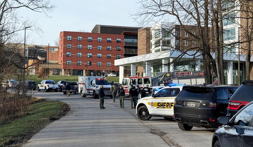 Law enforcement responds to a shooting at Whitney Moore Young Jr. Hall on Kentucky State University's campus in Frankfort, Ky., Tuesday, Dec. 9, 2025. (Hannah Brown/The State Journal via AP)