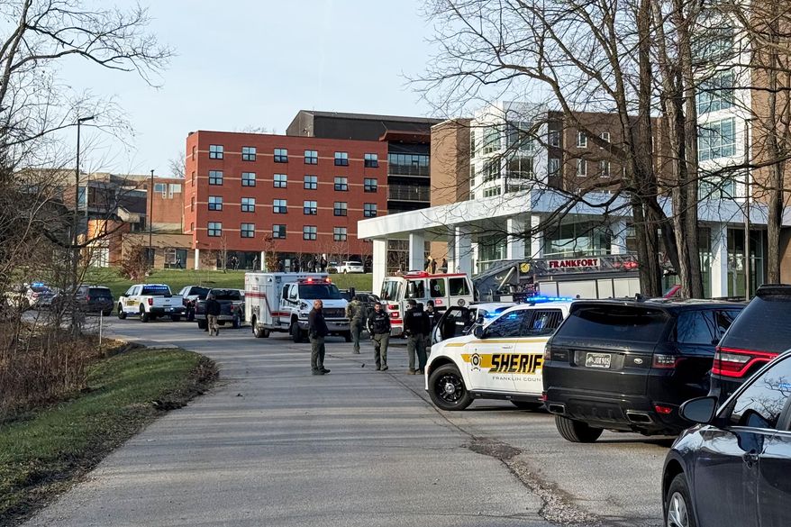 Law enforcement responds to a shooting at Whitney Moore Young Jr. Hall on Kentucky State University's campus in Frankfort, Ky., Tuesday, Dec. 9, 2025. (Hannah Brown/The State Journal via AP)