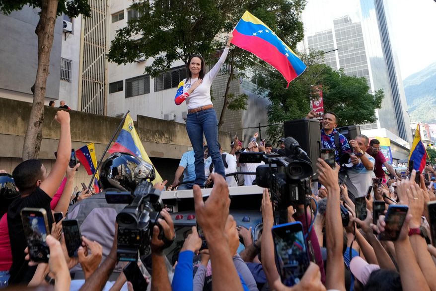 Venezuelan opposition leader Maria Corina Machado addresses supporters during a protest against President Nicolas Maduro the day before his inauguration for a third term in Caracas, Venezuela, Thursday, Jan. 9, 2025. (AP Photo/Matias Delacroix, File)