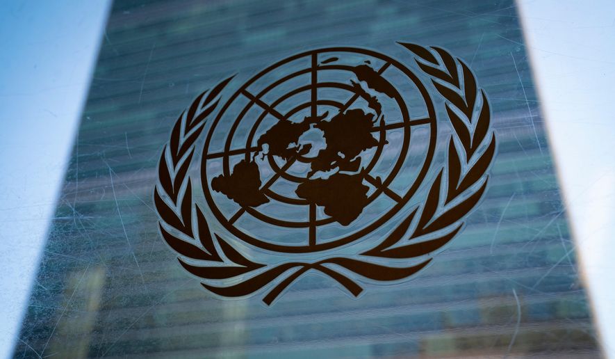 The symbol of the United Nations is displayed outside the Secretariat Building, Feb. 28, 2022, at United Nations Headquarters. (AP Photo/John Minchillo) **FILE**