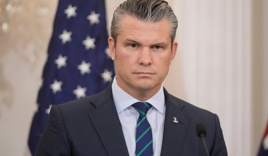 Defense Secretary Pete Hegseth listens during news conference with Australia's Deputy Prime Minister and Defense Minister Richard Marles, Australia's Foreign Minister Penny Wong and Secretary of State Marco Rubio at the State Department, Monday, Dec. 8, 2025, in Washington. (AP Photo/Mark Schiefelbein)