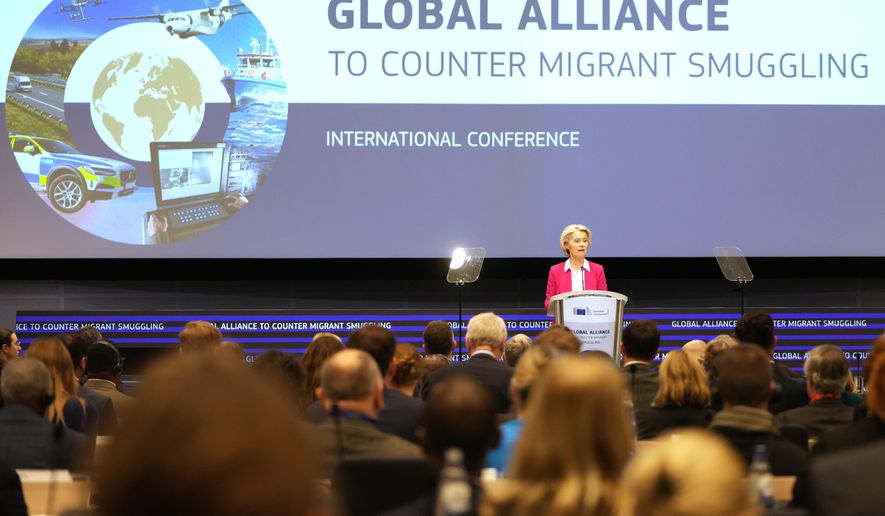 European Commission President Ursula von der Leyen addresses a Conference of the Global Alliance to Counter Migrant Smuggling at the EU Charlemagne building in Brussels, Wednesday, Dec 10, 2025. (AP Photo/Virginia Mayo)