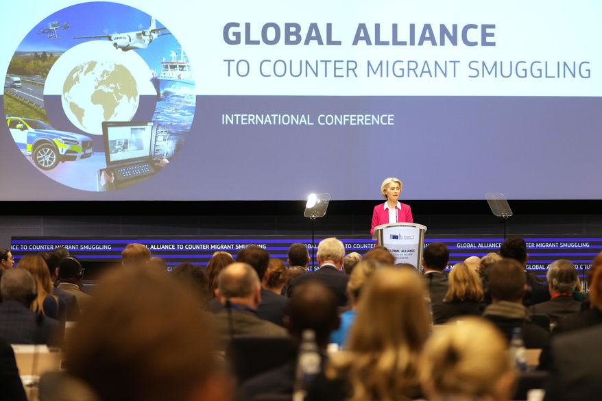 European Commission President Ursula von der Leyen addresses a Conference of the Global Alliance to Counter Migrant Smuggling at the EU Charlemagne building in Brussels, Wednesday, Dec 10, 2025. (AP Photo/Virginia Mayo)