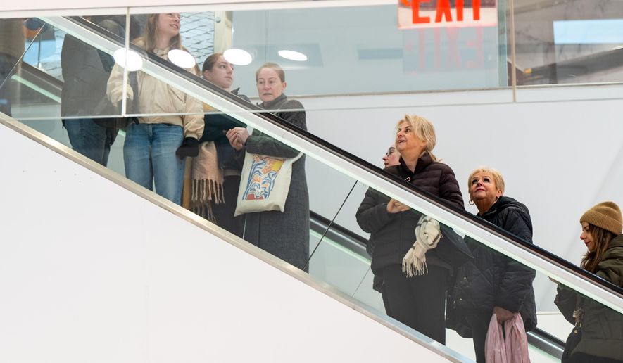 Black Friday Shoppers enter Macy's flagship store at opening time in New York on Friday, Nov. 28, 2025. (AP Photo/Angelina Katsanis)