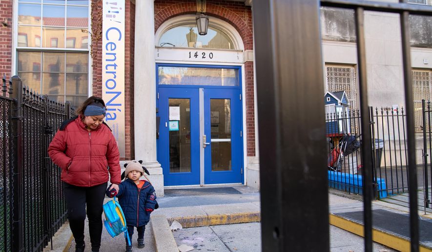 Families leave CentroNia at the end of the school day in Washington, Tuesday, Dec. 9, 2025. (AP Photo/Jacquelyn Martin)