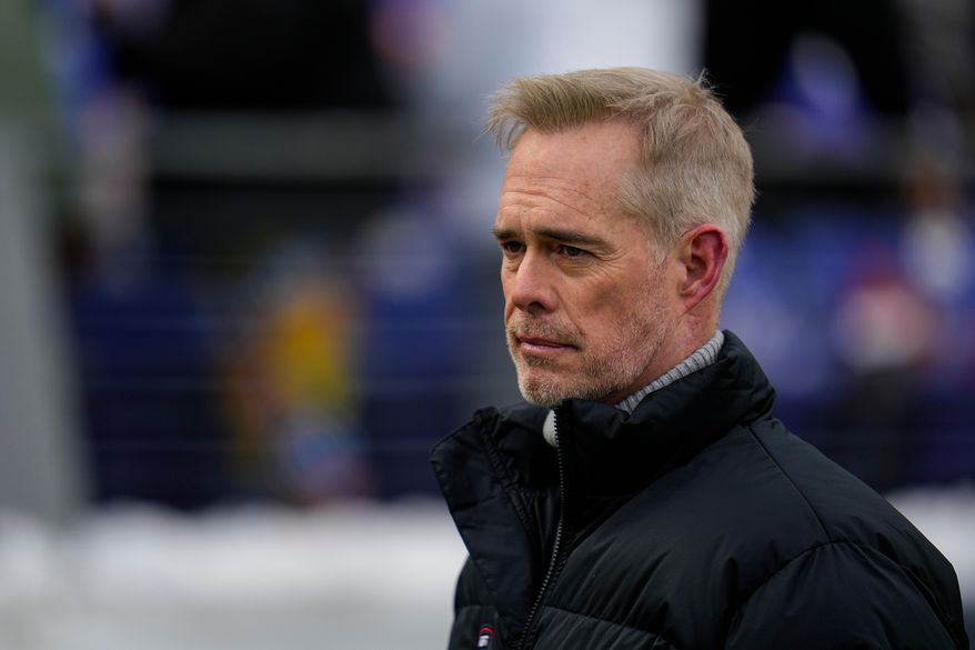 ESPN broadcaster Joe Buck walks the field before an NFL football AFC divisional playoff game between the Baltimore Ravens and the Houston Texans, Jan. 20, 2024, in Baltimore. (AP Photo/Julio Cortez, File)