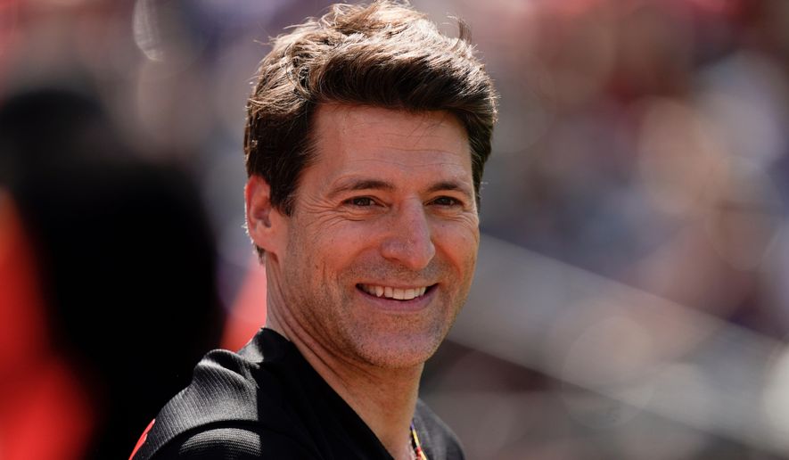 Tony Dokoupil, co-host of "CBS This Morning", looks on before throwing a ceremonial first pitch prior to a baseball game between the Baltimore Orioles and the Texas Rangers, May 27, 2023, in Baltimore. (AP Photo/Julio Cortez, File)