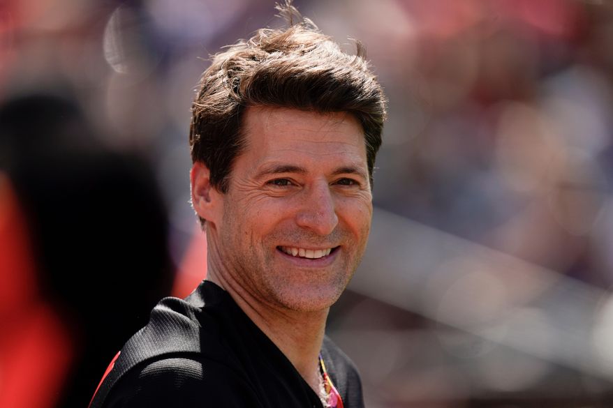Tony Dokoupil, co-host of "CBS This Morning", looks on before throwing a ceremonial first pitch prior to a baseball game between the Baltimore Orioles and the Texas Rangers, May 27, 2023, in Baltimore. (AP Photo/Julio Cortez, File)