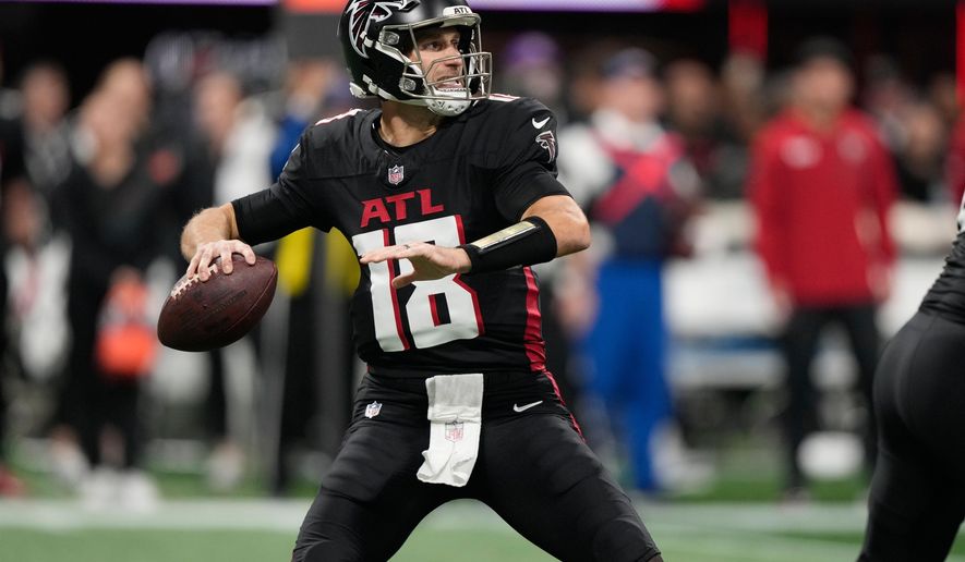 Atlanta Falcons quarterback Kirk Cousins throws against the Seattle Seahawks during the first half of an NFL football game, Sunday, Dec. 7, 2025, in Atlanta. (AP Photo/Brynn Anderson)