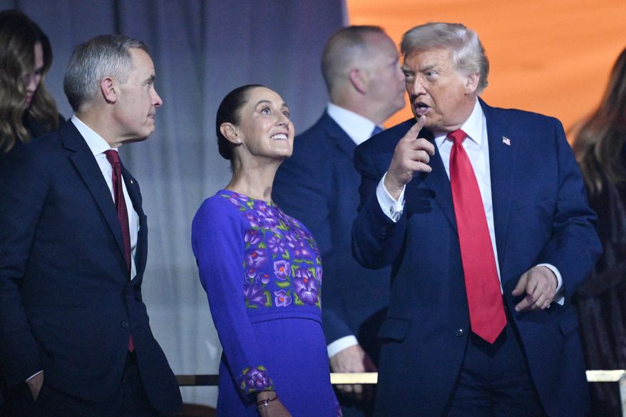 President Donald Trump speaks with Canadian Prime Minister Mark Carney and Mexican President Claudia Sheinbaum after the draw for the 2026 soccer World Cup at the Kennedy Center in Washington, Friday, Dec. 5, 2025. (Mandel Ngan/Pool Photo via AP)