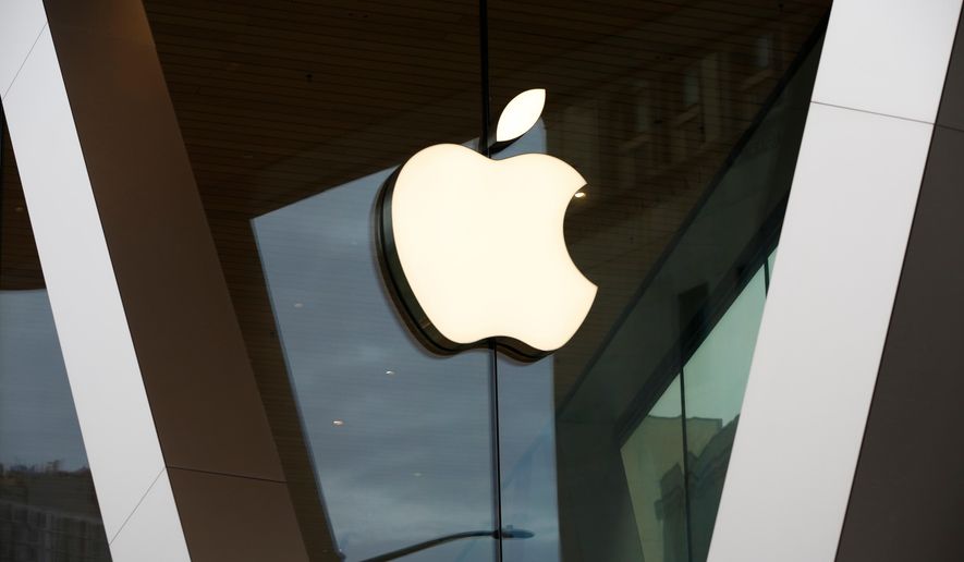 FILE - An Apple logo adorns the facade of the downtown Brooklyn Apple store on March 14, 2020, in New York. (AP Photo/Kathy Willens, File)