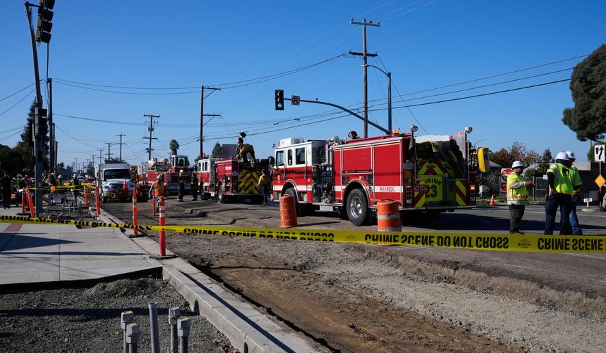 Emergency vehicles are lined up at the scene of a gas explosion Thursday, Dec. 11, 2025, in Hayward, Calif. (AP Photo/Godofredo A. Vásquez)