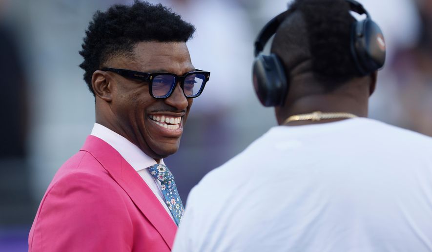 FILE -Former NFL quarterback and current sports commentator, Robert Griffin III, on the field before an NCAA football game between Colorado and TCU on Oct. 4, 2025, in Fort Worth, Texas. (AP Photo/Mike Buscher), File)