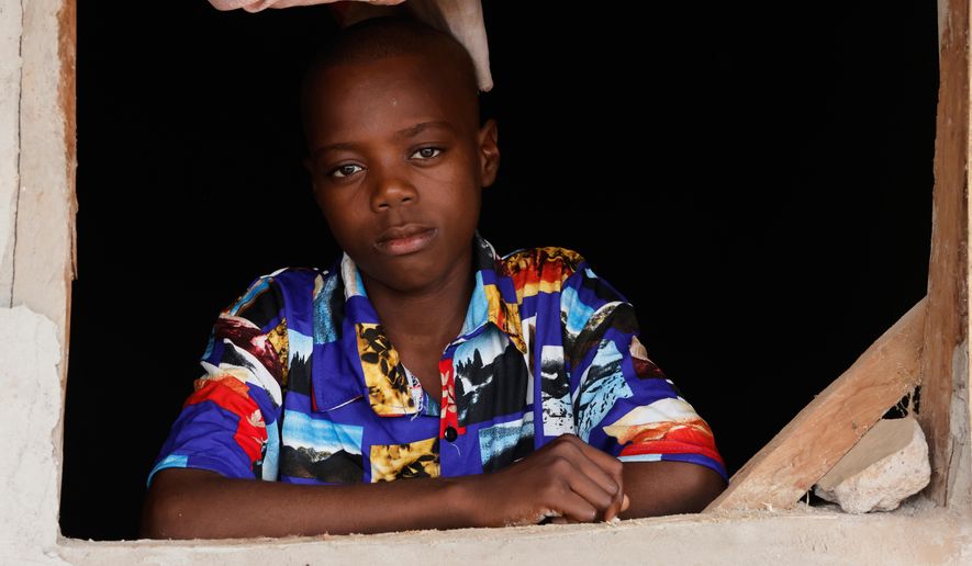 Onyeka Chieme, a student of St. Mary's Catholic School, abducted by gunmen and later released, poses for a photograph at his house in Papiri, Nigeria, Wednesday, Dec. 10, 2025. (AP Photo/Afolabi Sotunde)