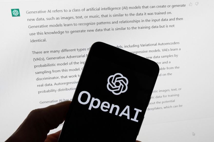 FILE - The OpenAI logo is displayed on a mobile phone in front of a computer screen with output from ChatGPT, March 21, 2023, in Boston. (AP Photo/Michael Dwyer, File)