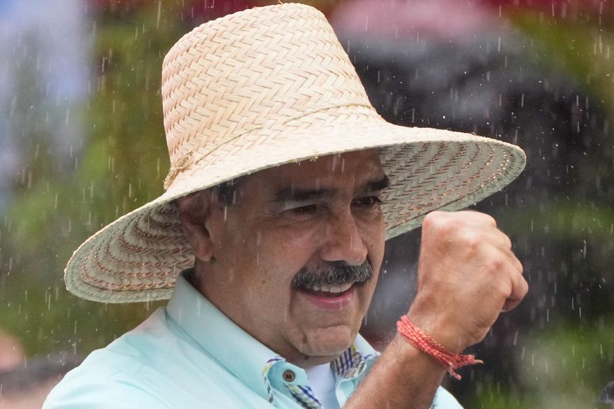 President Nicolas Maduro addresses supporters during a rally marking the anniversary of the Battle of Santa Ines, which took place during Venezuela's 19th-century Federal War, in Caracas, Venezuela, Wednesday, Dec. 10, 2025. (AP Photo/Ariana Cubillos)