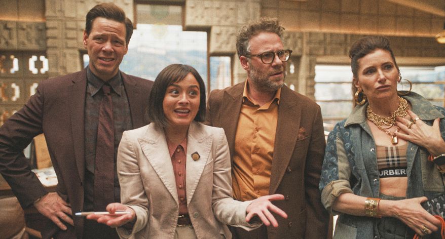 This image released by Apple TV shows Ike Barinholtz, from left, Chase Sui Wonders, Seth Rogen and Kathryn Hahn in a scene from "The Studio." (Apple TV via AP)