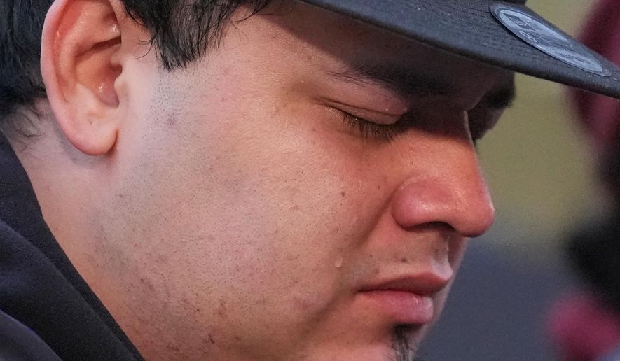 Kilmar Abrego Garcia cries during a rally ahead of a mandatory check at the Immigration and Customs Enforcement office in Baltimore, Friday, Dec. 12, 2025, after he was released from detention on Thursday under a judge's order. (AP Photo/Stephanie Scarbrough)