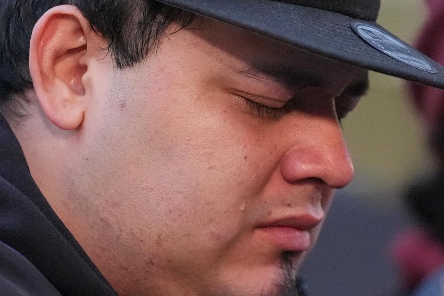 Kilmar Abrego Garcia cries during a rally ahead of a mandatory check at the Immigration and Customs Enforcement office in Baltimore, Friday, Dec. 12, 2025, after he was released from detention on Thursday under a judge's order. (AP Photo/Stephanie Scarbrough)