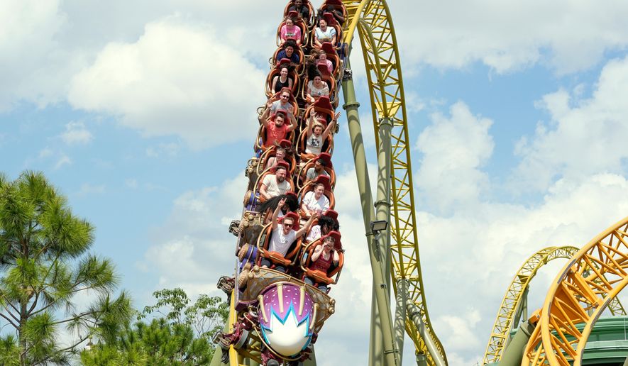 Guests ride on the Stardust Racers roller coaster at Epic Universe Theme Park at Universal Resort Orlando, April 10, 2025, in Orlando, Fla. (AP Photo/John Raoux, file)