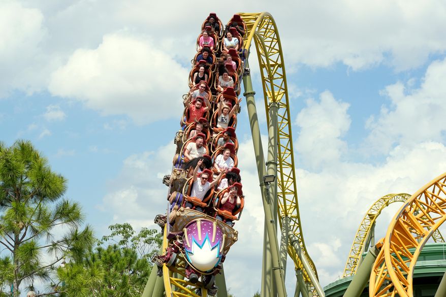 Guests ride on the Stardust Racers roller coaster at Epic Universe Theme Park at Universal Resort Orlando, April 10, 2025, in Orlando, Fla. (AP Photo/John Raoux, file)