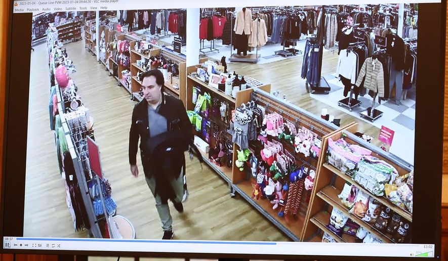 Surveillance video from a TJ Maxx in Norwell, Mass. showing Brian Walshe making purchases, is viewed as evidence during Walsh's murder trial, Wednesday, Dec. 10, 2025, in Dedham, Mass. (Mark Stockwell /The Boston Herald via AP, Pool)