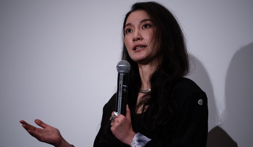 Director Shiori Itō speaks after the Japan premiere of "Black Box Diaries" at a cinema in Tokyo, Friday, Dec. 12, 2025. (AP Photo/Louise Delmotte)