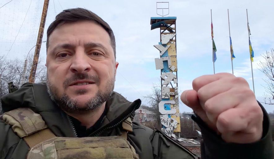 In this grab from a video provided by the Press Service Of The President Of Ukraine on Friday, Dec 12, 2025, Ukraine's President Volodymyr Zelenskyy records a video at the road entering of Kupiansk, Ukraine. (Press Service Of The President Of Ukraine via AP)