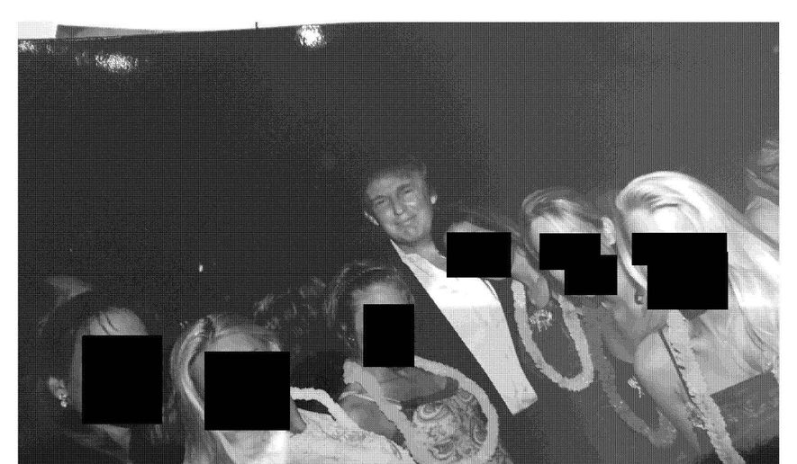 This undated, redacted photo released by Democrats on the House Oversight Committee shows Donald Trump standing with a group of women. (House Oversight Committee via AP)