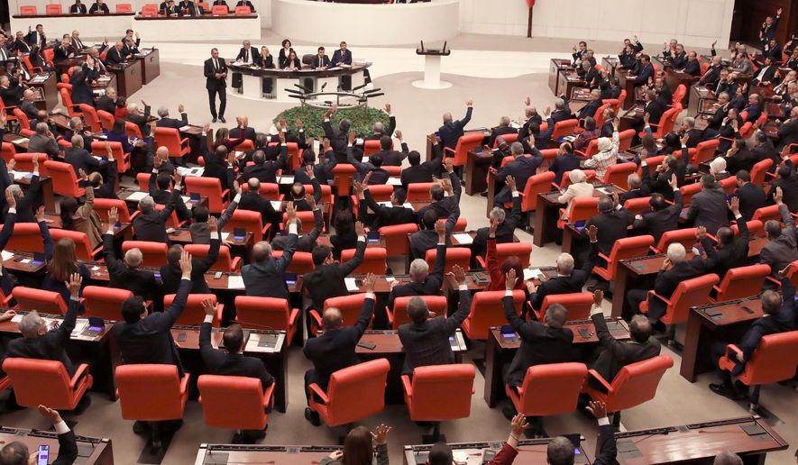 Members of Turkey's parliament vote in Ankara, Turkey, on Jan. 2, 2020. (AP Photo/Burhan Ozbilici, File)