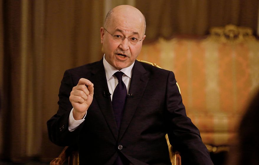 FILE - Iraq's President Barham Salih speaks during an interview with The Associated Press in Baghdad, Iraq, Friday, March 29, 2019. (AP Photo/Khalid Mohammed, File )