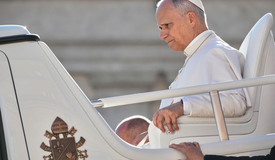 Pope Leo XIV leaves at the end of his weekly general audience in the St. Peter¥s Square at the Vatican, Wednesday, Dec. 10, 2025. (AP Photo/Andrew Medichini)