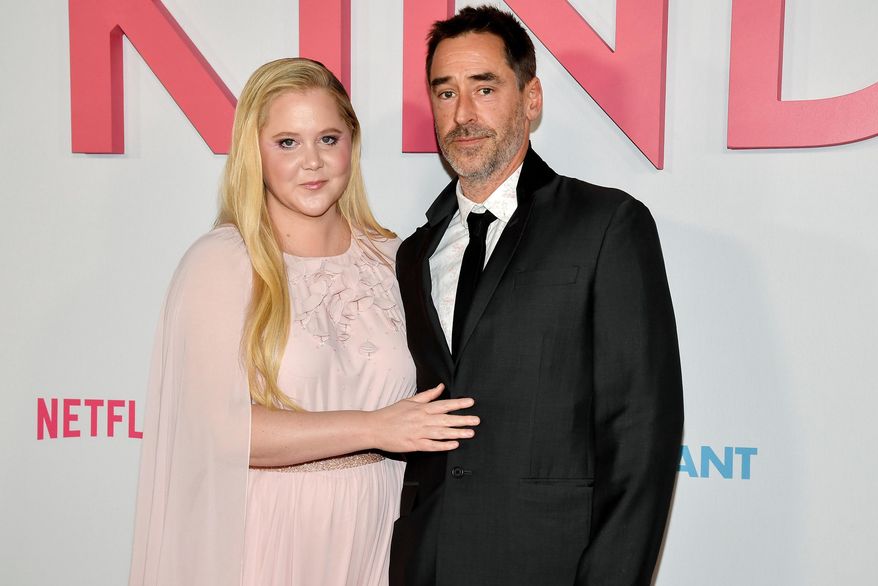 Amy Schumer and husband Chris Fischer attend the premiere of Netflix's "Kinda Pregnant" at The Plaza Hotel in New York, Feb. 3, 2025. (Photo by Evan Agostini/Invision/AP File)
