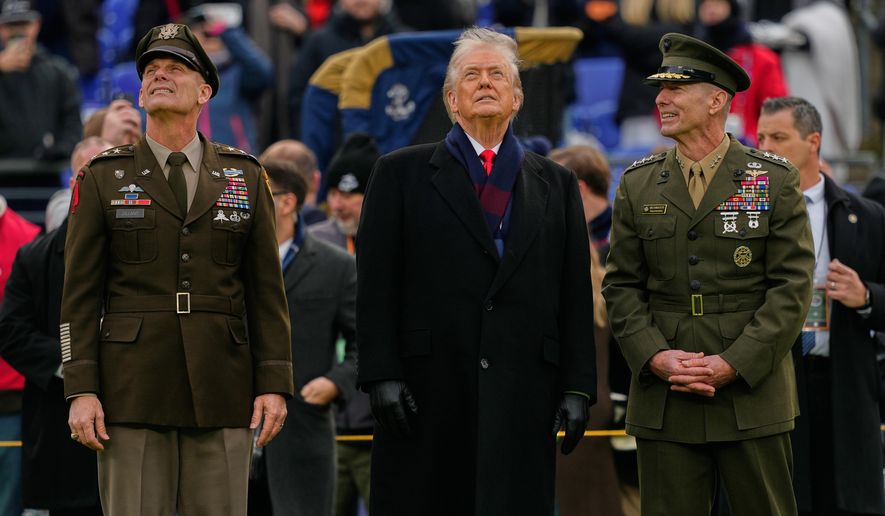 President Donald Trump stands with Lt. Gen. Steven Gilland, Superintendent of the U.S. Military Academy at West Point, left, and Lt. Gen. Michael Borgschulte, Superintendent of the U.S. Naval Academy, before the start of the 126th Army-Navy NCAA college football game at M&T Bank Stadium, Saturday, Dec. 13, 2025, in Baltimore. (AP Photo/Julia Demaree Nikhinson)