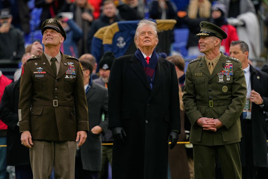 President Donald Trump stands with Lt. Gen. Steven Gilland, Superintendent of the U.S. Military Academy at West Point, left, and Lt. Gen. Michael Borgschulte, Superintendent of the U.S. Naval Academy, before the start of the 126th Army-Navy NCAA college football game at M&T Bank Stadium, Saturday, Dec. 13, 2025, in Baltimore. (AP Photo/Julia Demaree Nikhinson)
