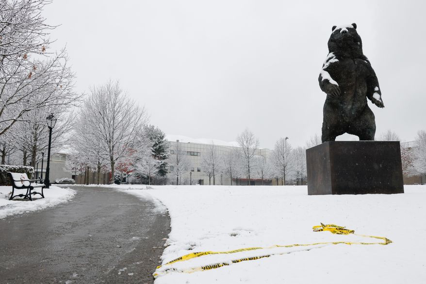 Police caution tape lays askew at Brown University's Ittleson Quad Sunday, Dec. 14, 2025, after a shooting on Saturday in Providence, R.I. (Lily Speredelozzi/The Sun Chronicle via AP)