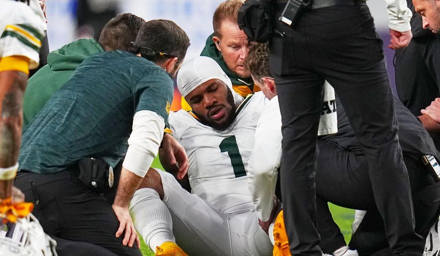 Green Bay Packers' Micah Parsons reacts after an injury during the second half of an NFL football game against the Denver Broncos Sunday, Dec. 14, 2025, in Denver. (AP Photo/Jack Dempsey)