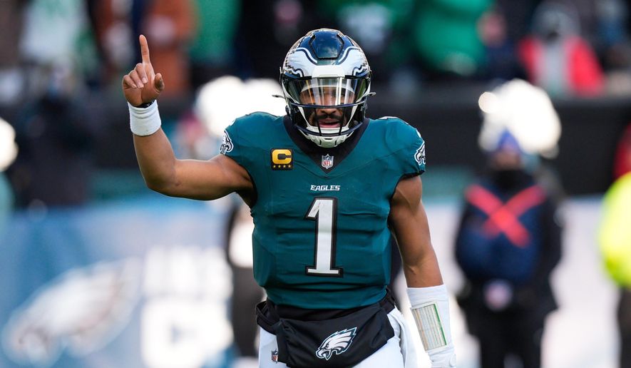 Philadelphia Eagles quarterback Jalen Hurts reacts to a touchdown by Eagles tight end Dallas Goedert during the second half of an NFL football game against the Las Vegas Raiders on Sunday, Dec. 14, 2025, in Philadelphia. (AP Photo/Chris Szagola)