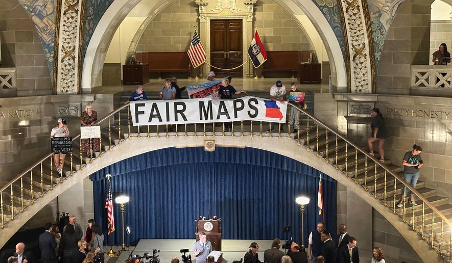 Opponents of Missouri's Republican-backed congressional redistricting plan display a banner in protest at the State Capitol in Jefferson City, Missouri, Sept. 10, 2025. (AP Photo/David A. Lieb)
