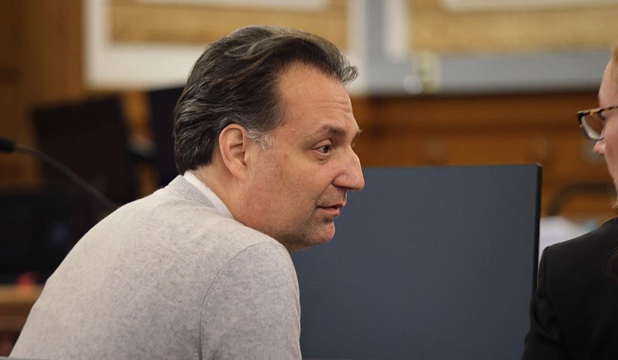 Brian Walshe, facing a first-degree murder charge for allegedly killing his wife Ana Walshe, speaks with his lawyer during testimony in his trial, Tuesday, Dec. 9, 2025, in Dedham, Mass. (Suzanne Kreiter/The Boston Globe via AP, File)